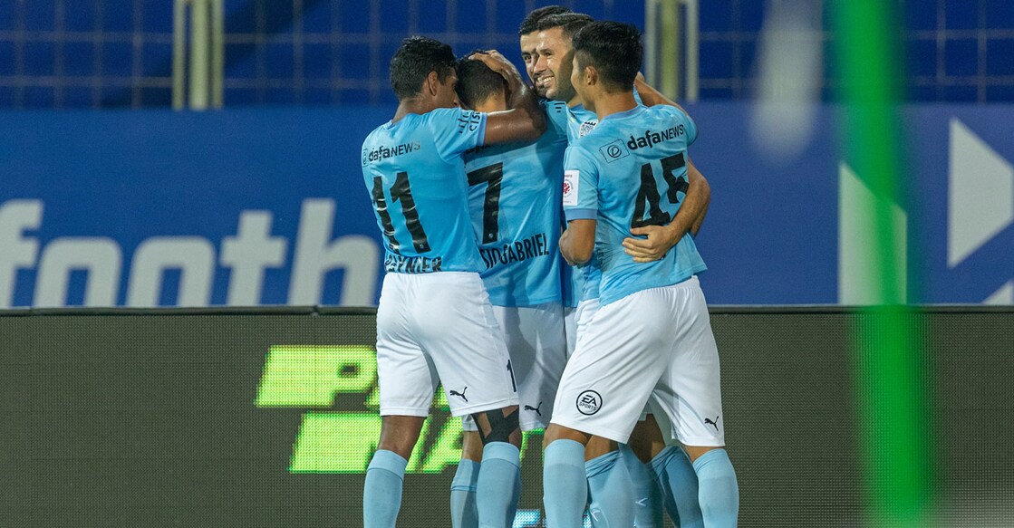Mumbai City FC players celebrate a goal against Jamshedpur FC. Photo: ISL