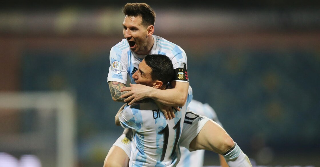 Argentina's Lionel Messi celebrates scoring their third goal with Angel Di Maria
