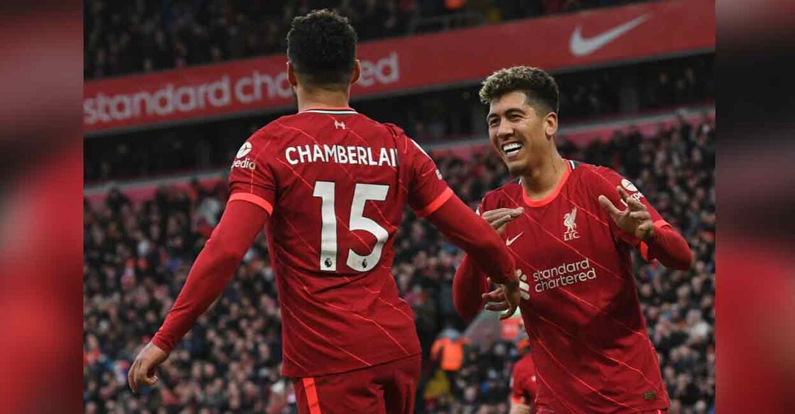 Liverpool's Alex Oxlade-Chamberlain (left) and Roberto Firmino celebrate a goal against Brentford at Anfield on Sunday. Photo: AFP

