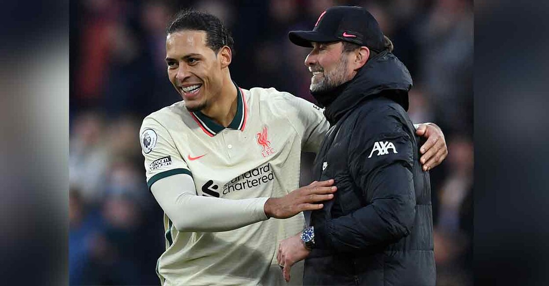 Liverpool's manager Jurgen Klopp celebrates with defender Virgil van Dijk (left) after their English Premier League match against Crystal Palace at Selhurst Park in south London on Sunday. Photo: AFP

