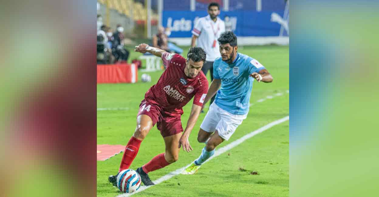 Action between Mumbai City (blue) and NorthEast United during an Indian Super League match on Tuesday. Photo: Twitter/ @IndSuperLeague