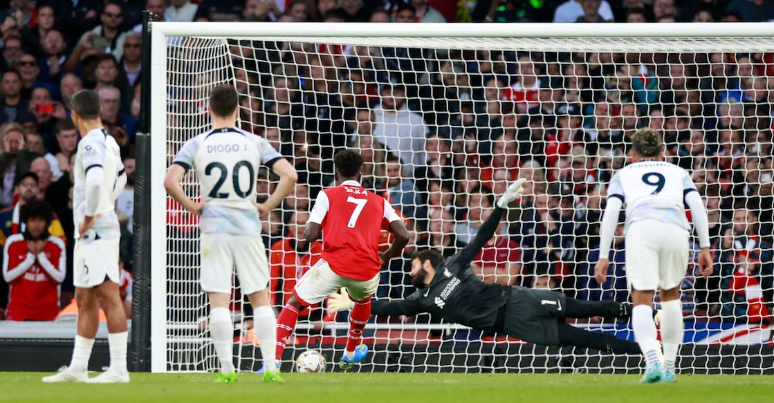 Arsenal's Bukayo Saka scores their third goal from the penalty spot against Liverpool. Photo: Reuters /Peter Cziborra
