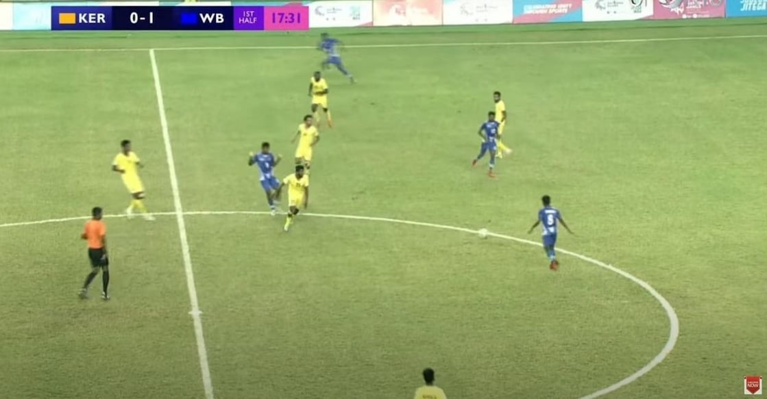 Kerala (in yellow jersey) and West Bengal players vie for the ball during the final of the men's football match in the 36th National Games in Ahmedabad on Tuesday. Screengrab/DD Sports