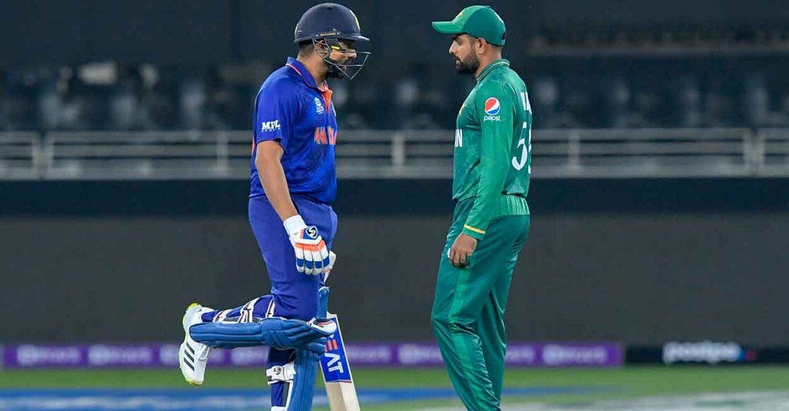 Indian captain Rohit Sharma with his Pakistani counterpart Babar Azam. File photo: AFP/Aamir Qureshi
