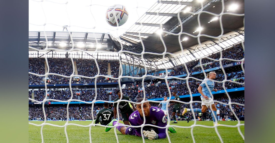 Manchester City's Erling Haaland celebrates scoring their fourth goal as Southampton's Gavin Bazunu reacts. Photo: Reuters/ Jason Cairnduff