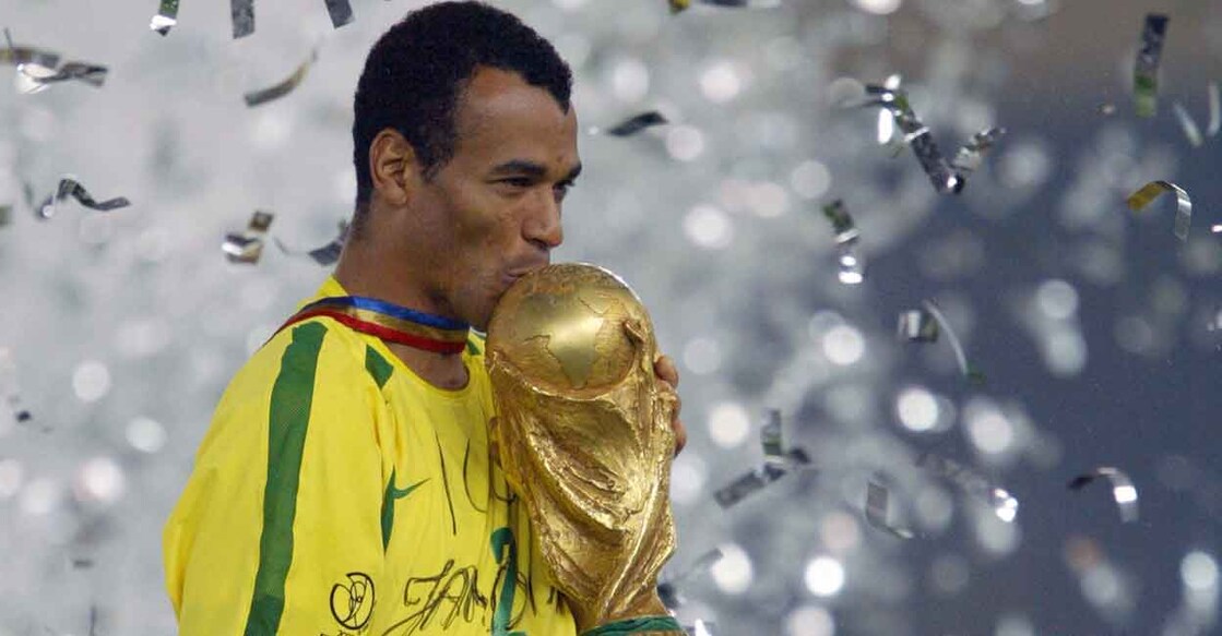 Brazilian captain Cafu kisses the trophy after winning the 2002 World Cup. File photo: AFP/Pedro Ugarte