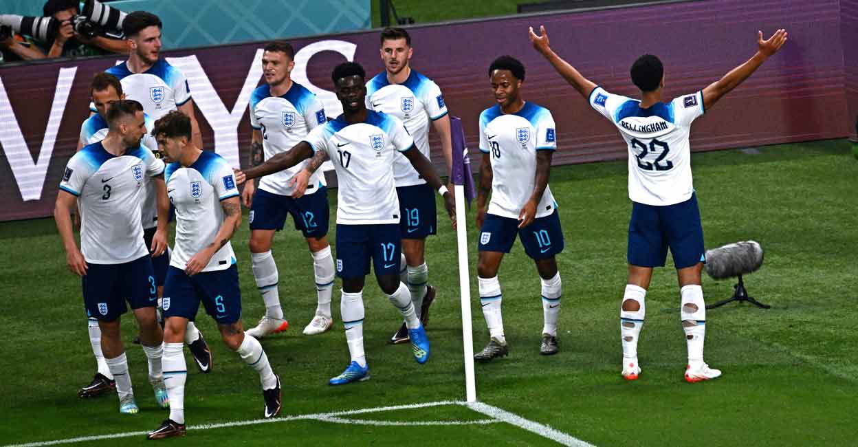 England England players celebrate the opening goal by Jude Bellingham, right. Photo: AFP/Anne-Christine Poujoulat