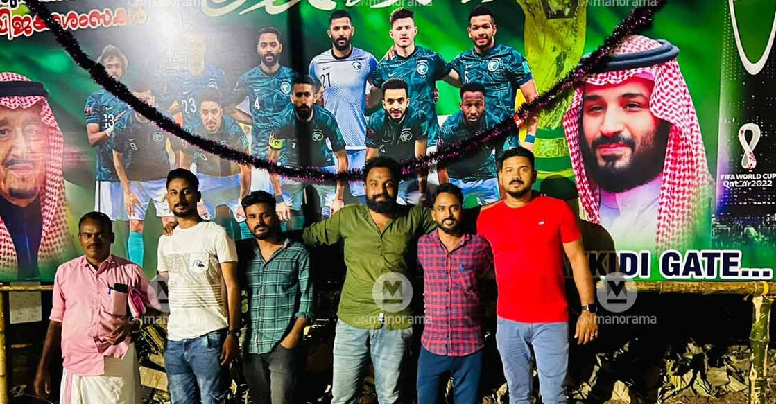 L-R: Expats from Saudi Arabia in front of a hoarding they erected in Lakkidi, in Palakkad. (L-R) Muhammed Kutty, Abdul Raheem, Nissar, Sreekuttan, Mohammed Riyas and Sulfikar. Photo: Special arrangement 