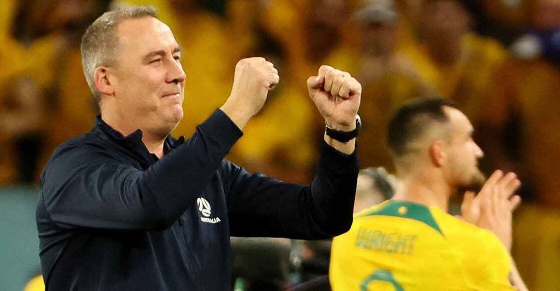 Australia assistant coach Rene Meulensteen celebrates qualifying for the knockout stages. Photo: Reuters/Wolfgang Rattay