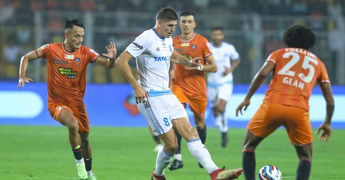 JFC's Harrison Hickey Sawyer surrounded by FCG players attempts to make a pass. FCG went on to win 3-0 (ISL)