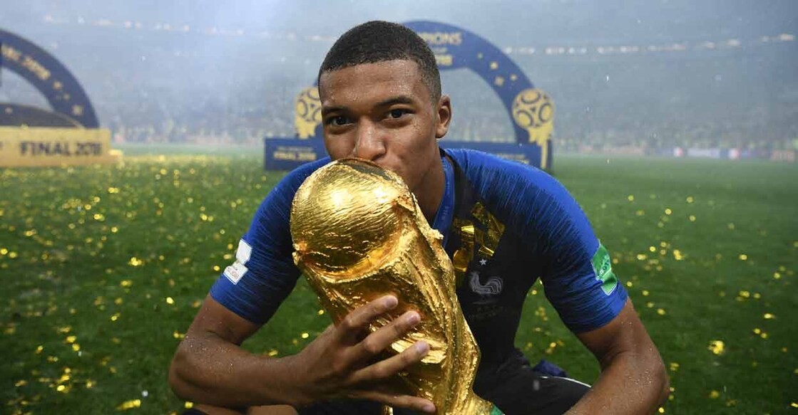 In this file photo taken on July 15, 2018 France's forward Kylian Mbappe kisses the World Cup trophy after the Russia 2018 World Cup final against Croatia at the Luzhniki Stadium in Moscow. Photo: AFP