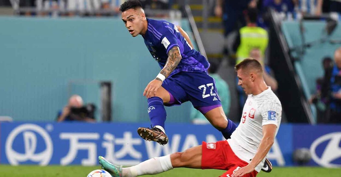 Argentina's Lautaro Martinez in action with Poland's Damian Szymanski. Photo: Reuters/Jennifer Lorenzini