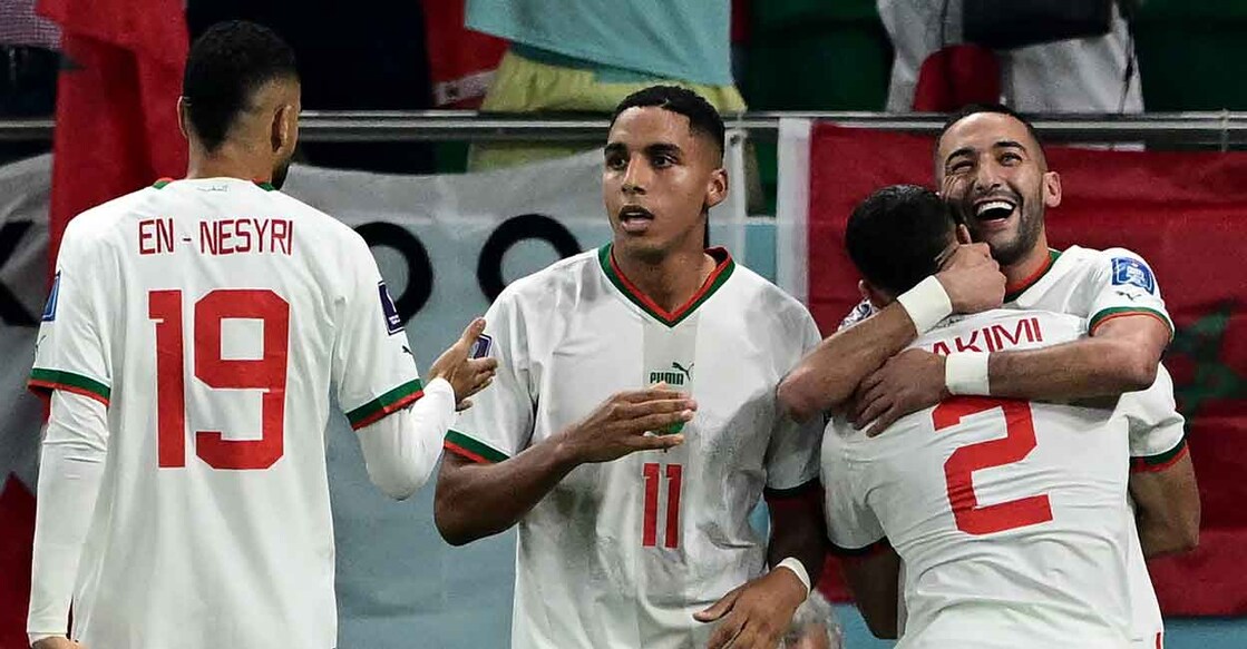 Morocco's Hakim Ziyech, right, celebrates with teammate's after scoring the opening goal. Photo: AFP/Miguel Median