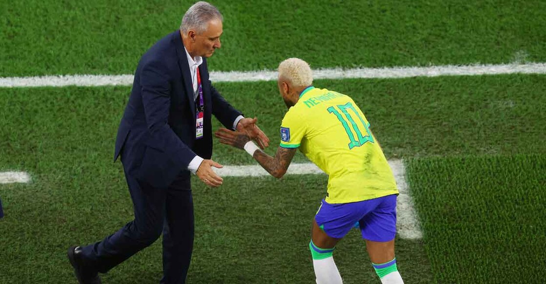 Tite with Neymar after Brazil scored their second goal. Photo: Reuters/Paul Childs