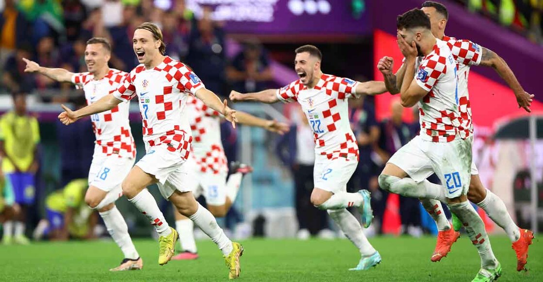 Croatian players celebrate their shootout win. Photo: Reuters/Hannah Mckay