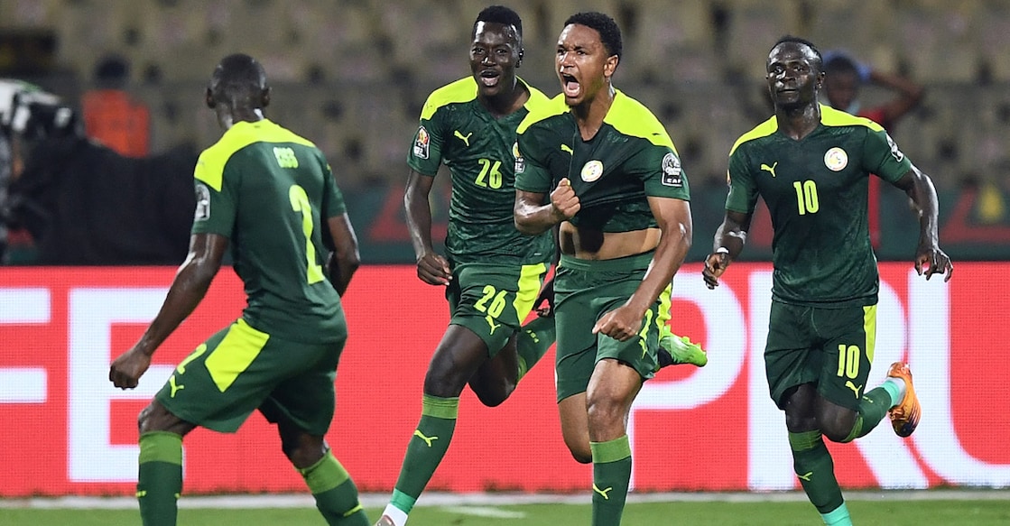 Senegal's Abdou Diallo, second right, celebrates scoring the opening goal of the match. Photo: AFP/Charly Triballeau