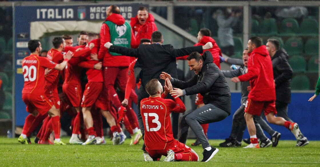 North Macedonia's Stefan Ristovski celebrates with teammates and support staff after beating Italy. Photo: Reuters/Guglielmo Mangiapane