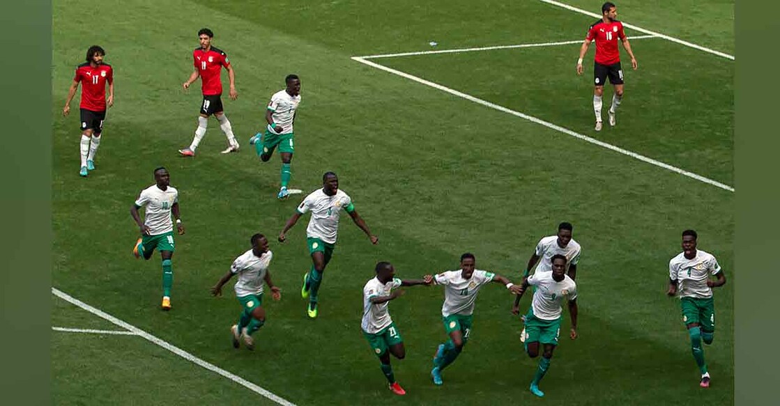 Senegal players celebrate their goal against Egypt during the World Cup playoff match in Dakar, Senegal on Tuesday. Photo: AP