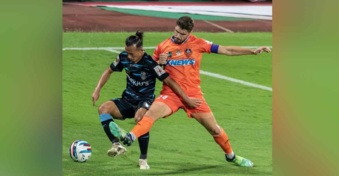Action between Kerala Blasters (black and blue) and FC Goa in the Indian Super League on Sunday. Photo: Twitter/ @IndSuperLeague