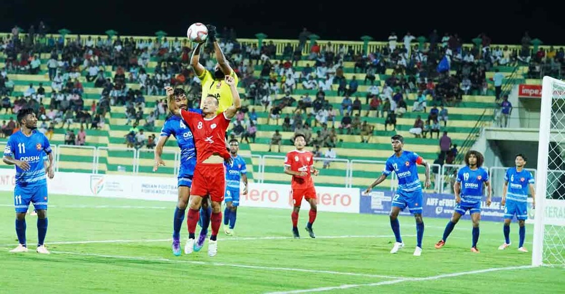 Action between Odisha (blue) and Manipur in the Santosh Trophy at the Payyanad Stadium in Manjeri, Malappuram on Tuesday. Photo: Special arrangement