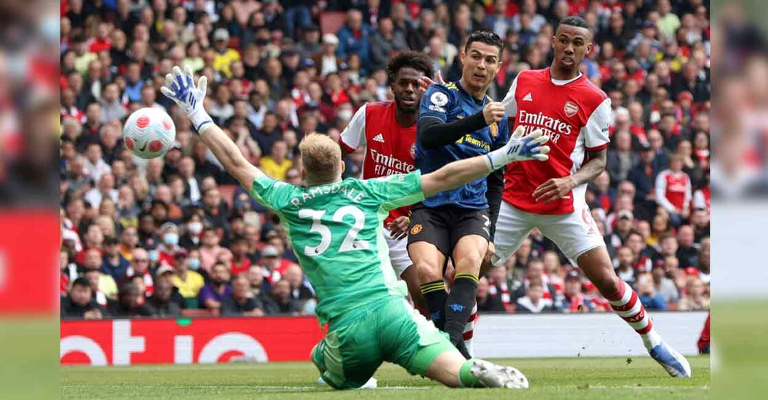 Manchester United's Cristiano Ronaldo scores against Arsenal in the Premier League. Photo: Paul Childs/Reuters