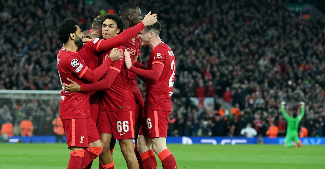 Liverpool's Jordan Henderson celebrates with teammates after scoring a goal. Photo: AFP/Lluis Gene