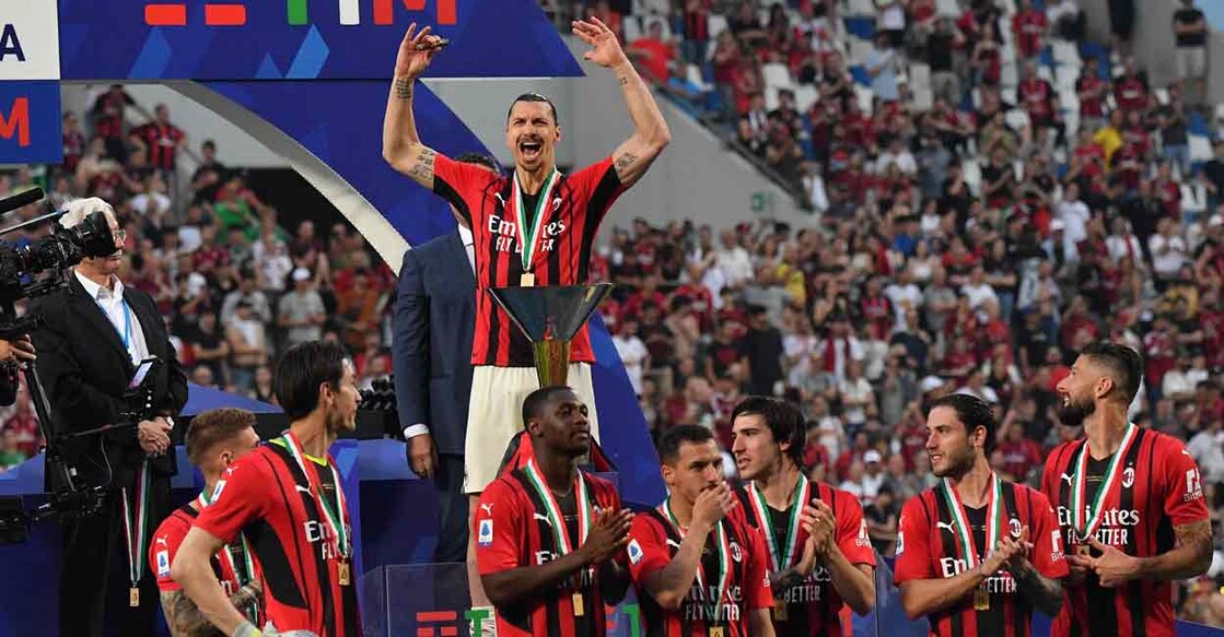 AC Milan's Swedish forward Zlatan Ibrahimovic (centre) and teammates celebrate with the Italian Serie A trophy at the Mapei - Citta del Tricolore stadium in Sassuolo. Photo: AFP/ Tiziana Fabi