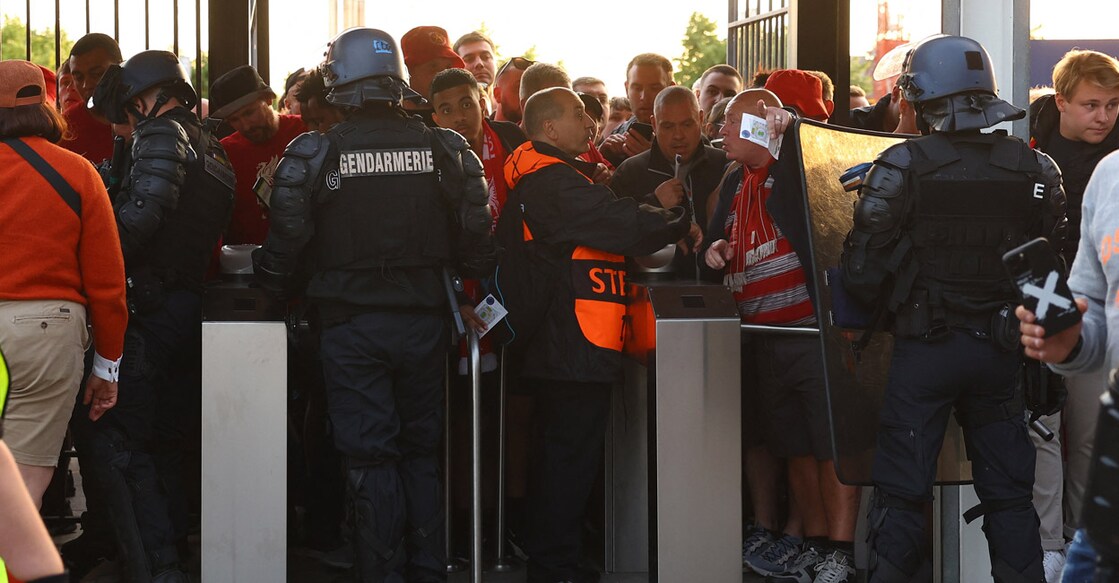 Fans, stewards and police officers at the turnstiles inside the Stade de France in Paris. Photo: Reuters Kai Pfaffenbach
