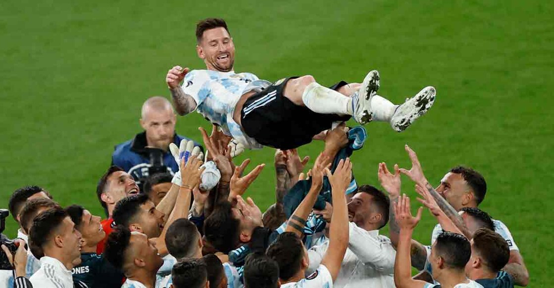 Argentina's Lionel Messi is tossed by with teammates. REUTERS/John Sibley