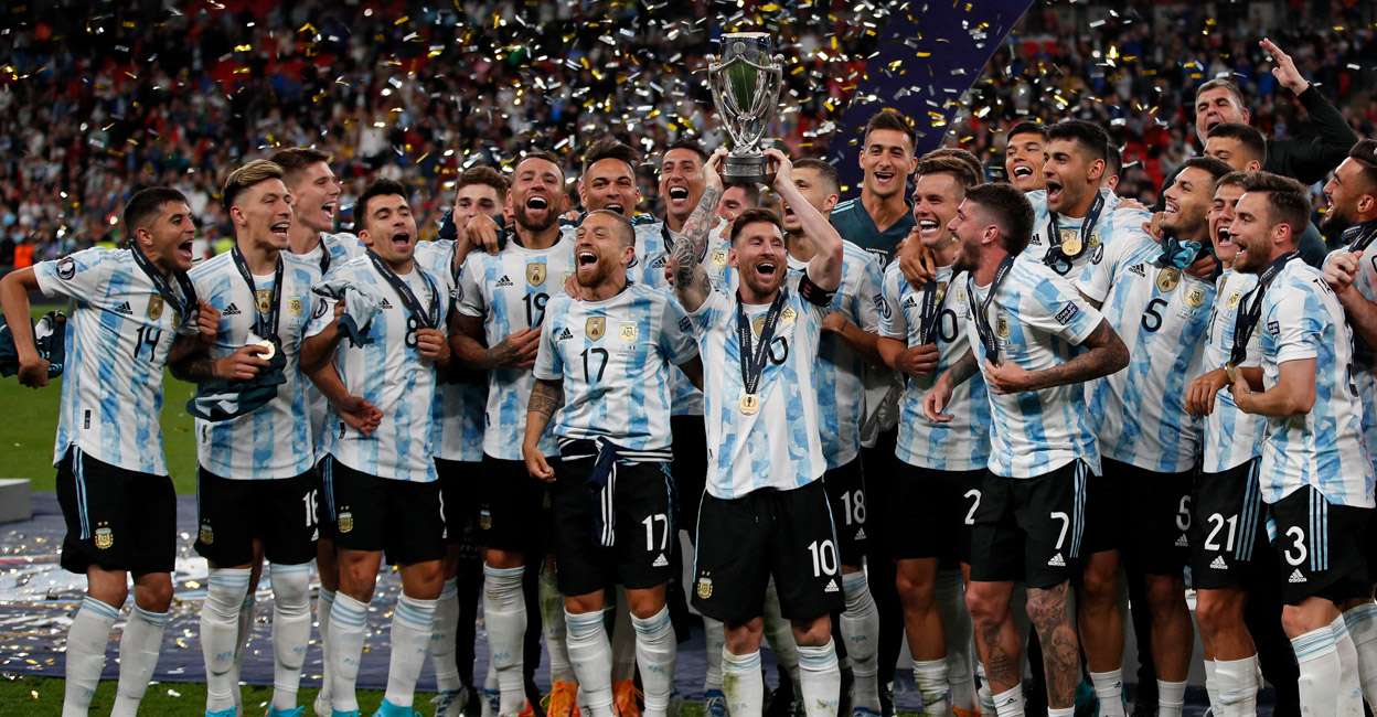  The image shows the Argentina National Football Team celebrating their victory in the 2022 Finalissima wearing their 2022 jerseys.