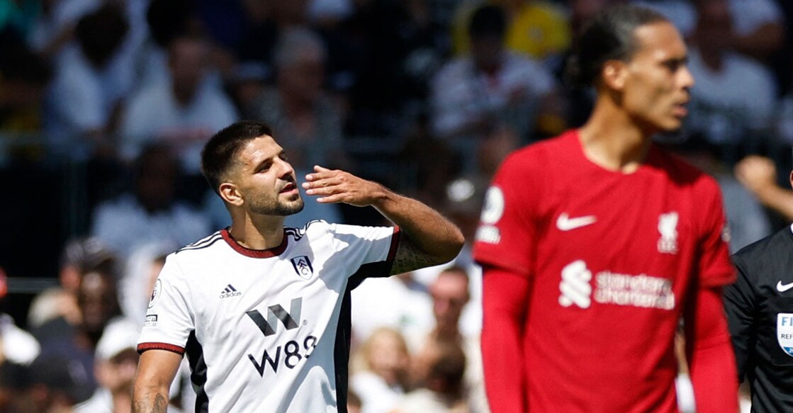 Fulham's Aleksandar Mitrovic celebrates scoring their second goal as Liverpool's Virgil van Dijk looks on. Photo: Reuters/ Peter Cziborra
