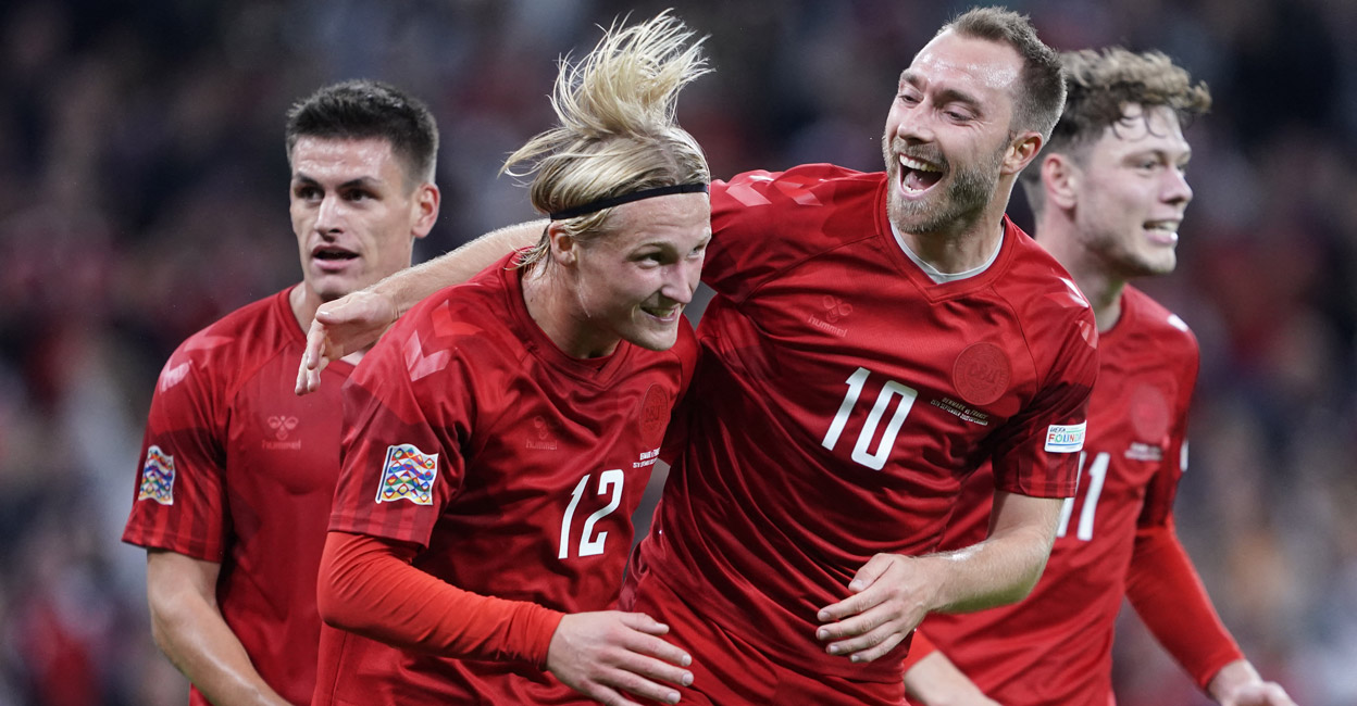 Denmark's Kasper Dolberg (No. 12) celebrates with Christian Eriksen after scoring the opening goal. Photo: AFP/Liselotte Sabroe