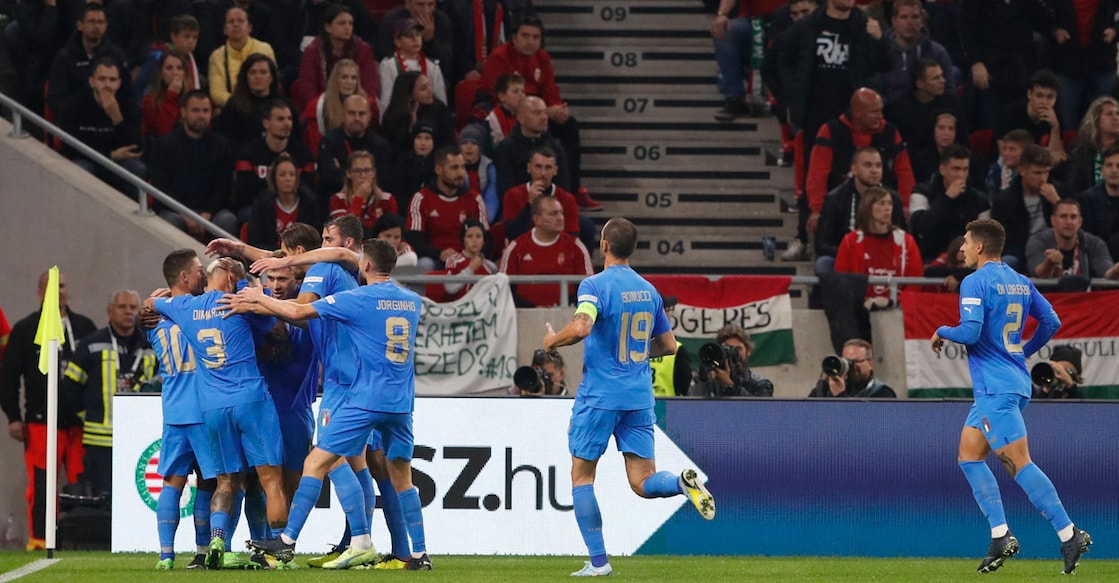 Italian players celebrate their opening goal against Hungary. Photo: Reuters/Bernadett Szabo
