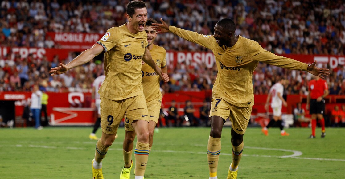 Barcelona's Robert Lewandowski celebrates with Ousmane Dembele after scoring their second goal. Photo: Reuters/Marcelo Del Pozo