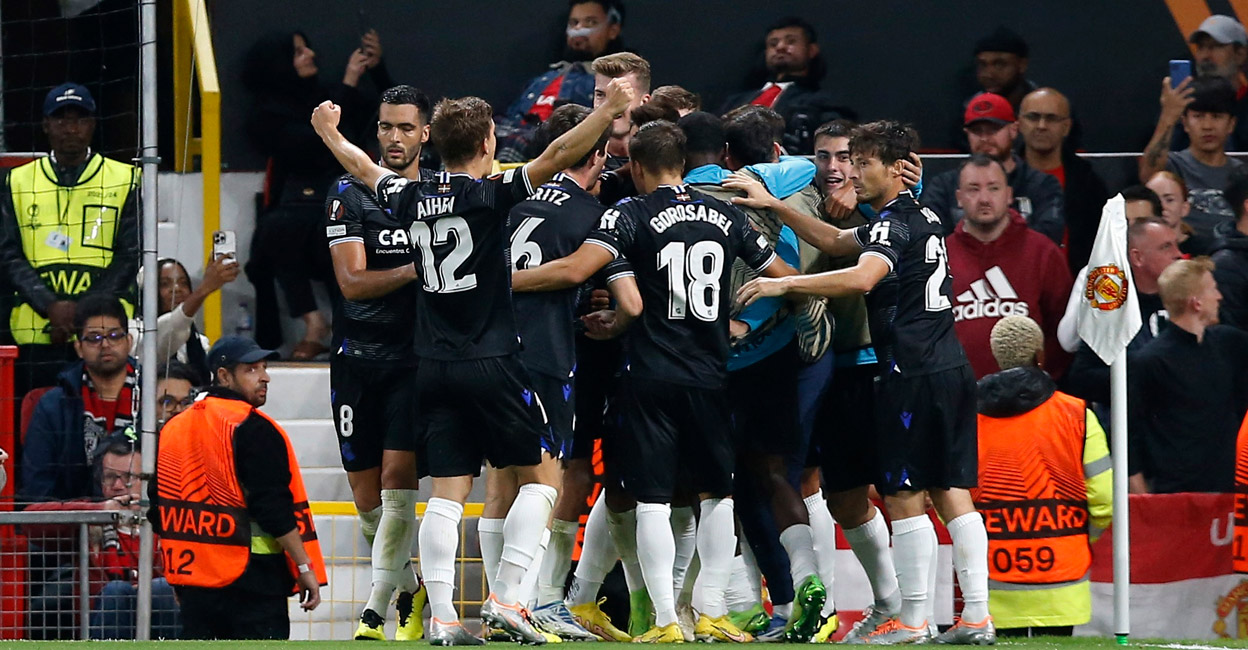 Real Sociedad's Brais Mendez celebrates with teammates after scoring their first goal. Photo: Reuters/Craig Brough