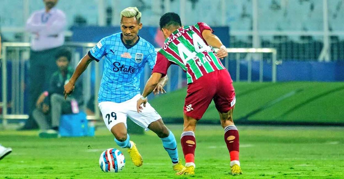 Players of Mumbai City (blue) and ATK Mohun Bagan in action. Photo: ISL