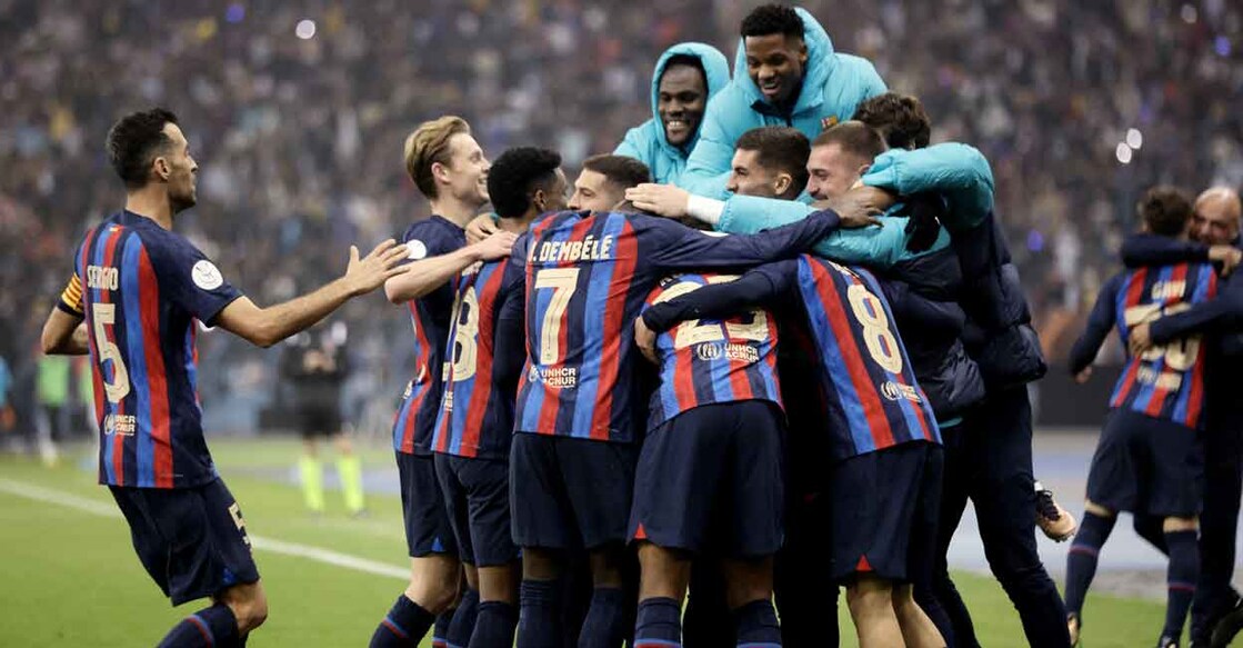 Barcelona players celebrate scoring their third goal. Photo: Reuters/Ahmed Yosri