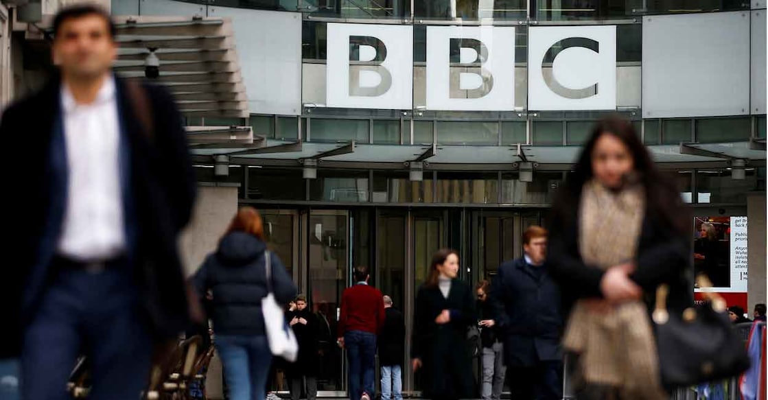 Pedestrians walk past a BBC logo in London. File photo: Reuters/Henry Nicholls