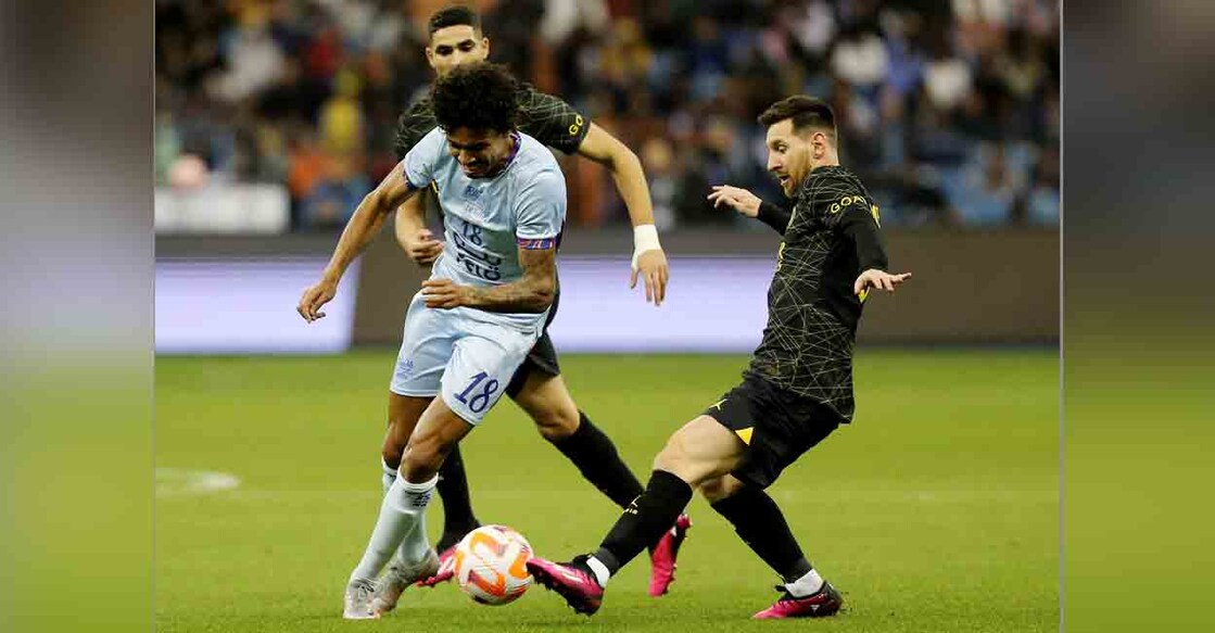 Paris St Germain's Lionel Messi in action with Saudi Pro League XI's Luiz Gustavo at King Fahd International Stadium, Riyadh, Saudia Arabia - January 19, 2023. Photo: REUTERS/Ahmed Yosri