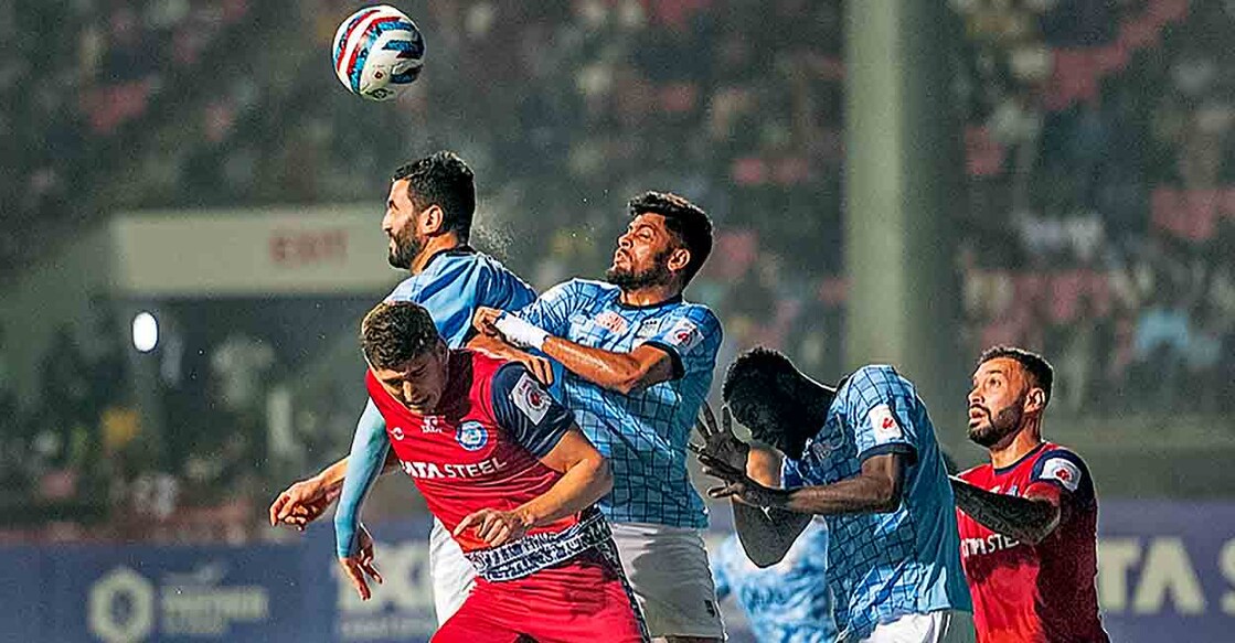 Jamshedpur FC players and Mumbai City FC players (in blue) vie for the ball during their Indian Super League 2022-23 match, at the JRD Tata Sports Complex in Jamshedpur, Friday, Jan. 27, 2023. (ISL/PTI Photo) 