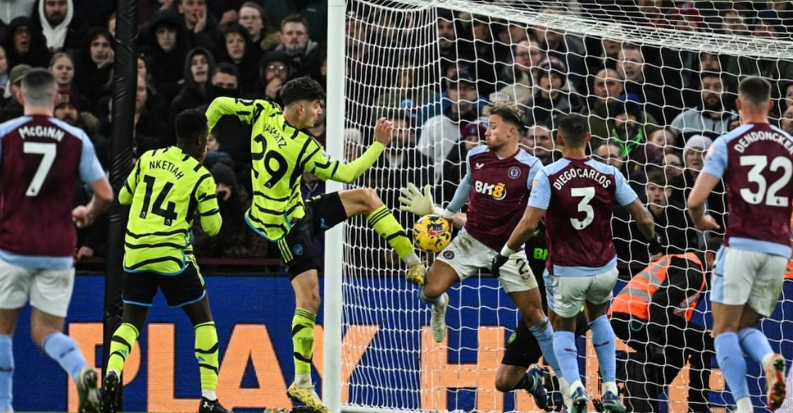 Arsenal's German midfielder Kai Havertz (L) and Aston Villa's English defender Matty Cash (R) fight for the ball in front of the goal during the English Premier League football match . Photo: Justin Tallis/ AFP