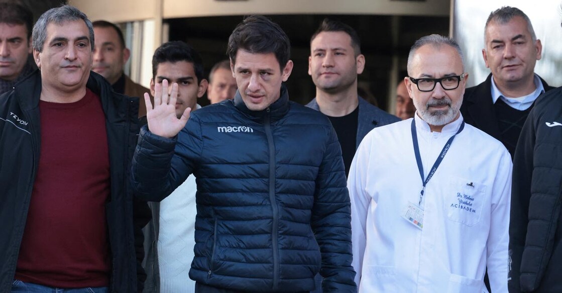 Turkish referee Halil Umut Meler greets media members as he leaves a hospital in Ankara. Photo: Reuters/Cagla Gurdogan