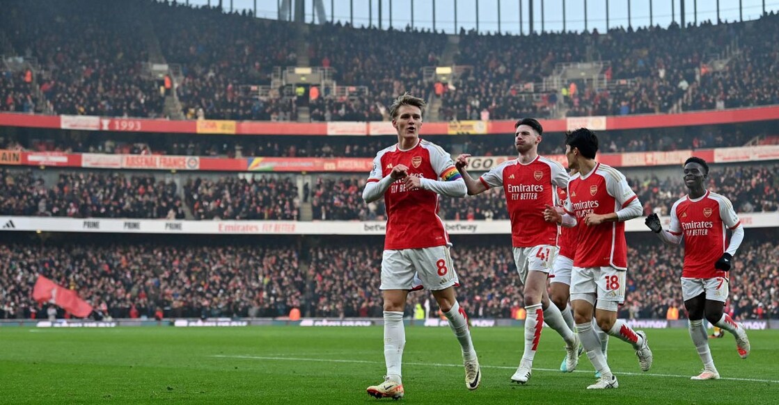 Arsenal's Martin Odegaard, left,,celebrates scoring their second goal against Wolverhampton Wanderers. Photo: AFP/Glyn Kirk
