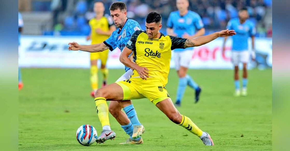 Action between Mumbai City (blue) and Hyderabad FC in the Indian Super League. Photo: ISL