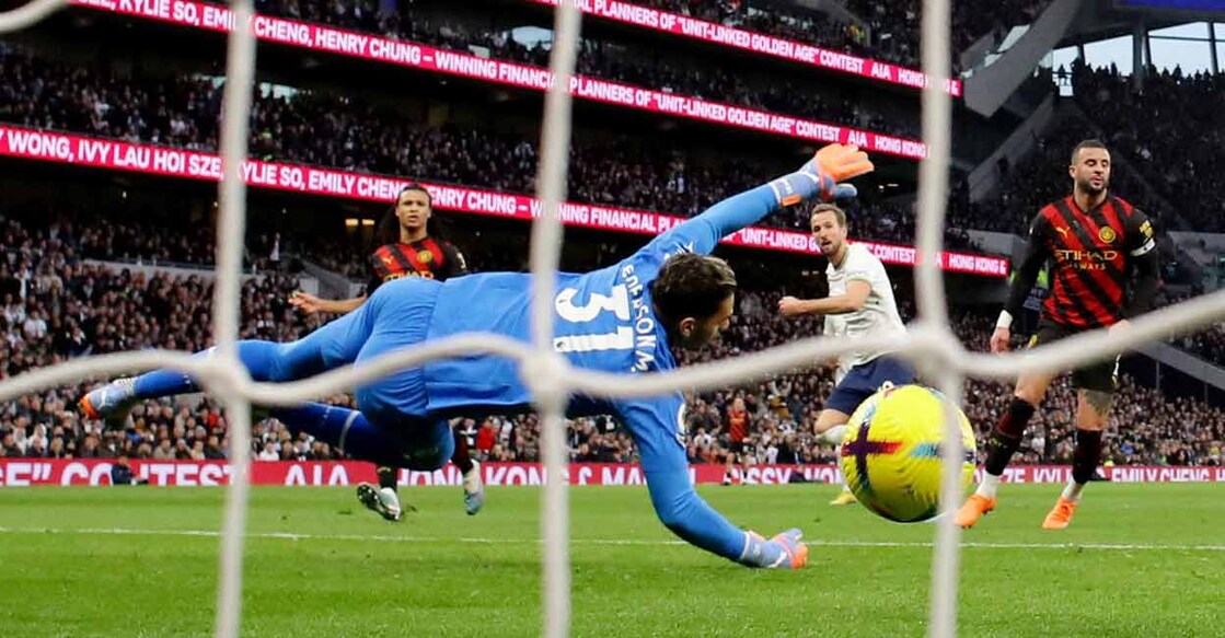 Tottenham Hotspur's Harry Kane scores the winner past Manchester City's Ederson. Photo: Reuters/ David Klein