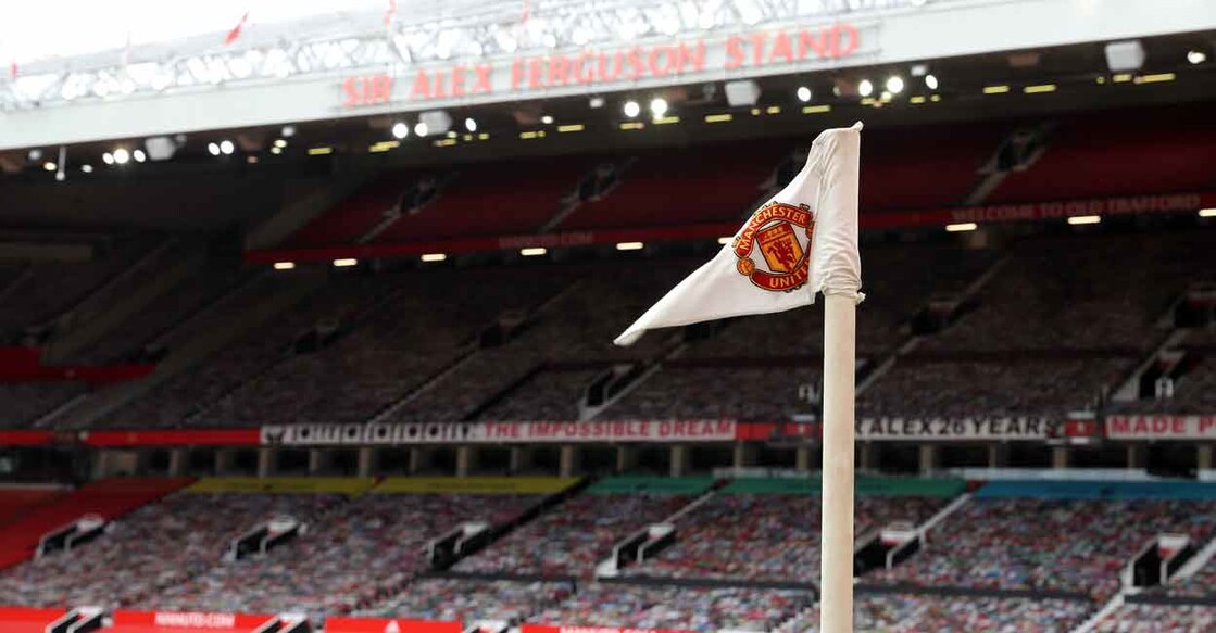 Manchester United logo on a corner post flag. File photo: AFP/Martin Rickett