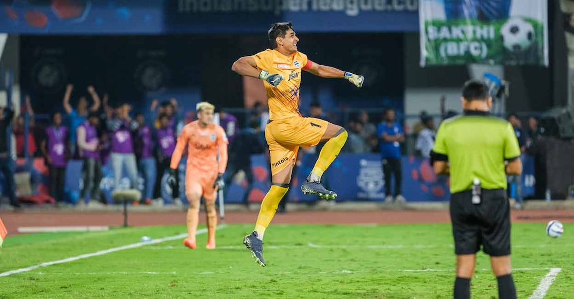 Bengaluru FC goalkeeper Gurpreet Sandhu celebrates after saving a penalty in the shootout against Mumbai City in the second leg of the Indian Super League semifinal on Sunday. 