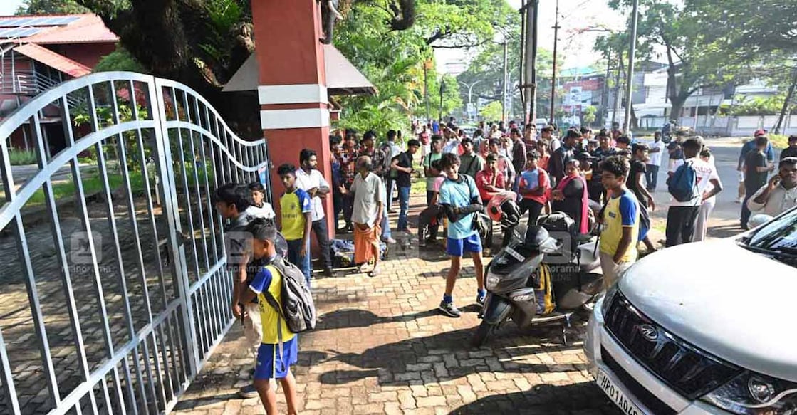 Aspiring footballers were forced to wait for hours for the gates to open. Photo: Manorama