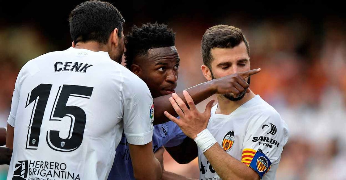 Vinicius Jr Real Madrid's Vinicius Jr gestures towards a fan as Valencia's Jose Gaya and Cenk Ozkacar attempt to restrain him. File photo: Reuters/Pablo Morano