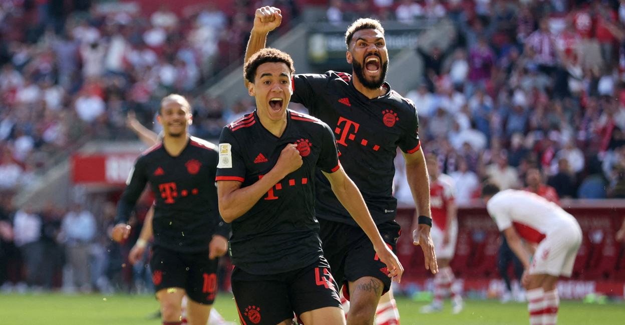 Bayern Munich's Jamal Musiala celebrates scoring their winner with Eric Maxim Choupo-Moting. Photo: Reuters/Thilo Schmuelgen